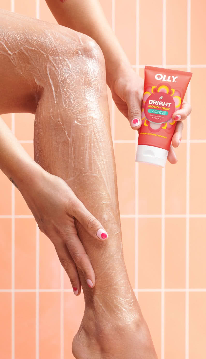 woman applying OLLY Bright Mood + Skin Body Scrub icon