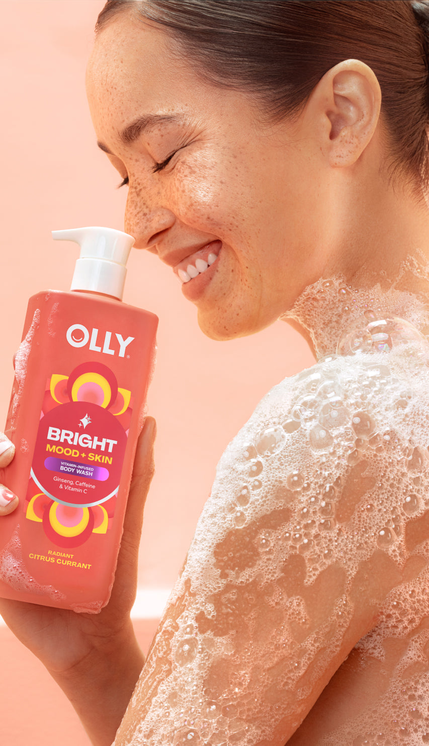 woman holding OLLY Bright Mood + Skin Body Wash icon