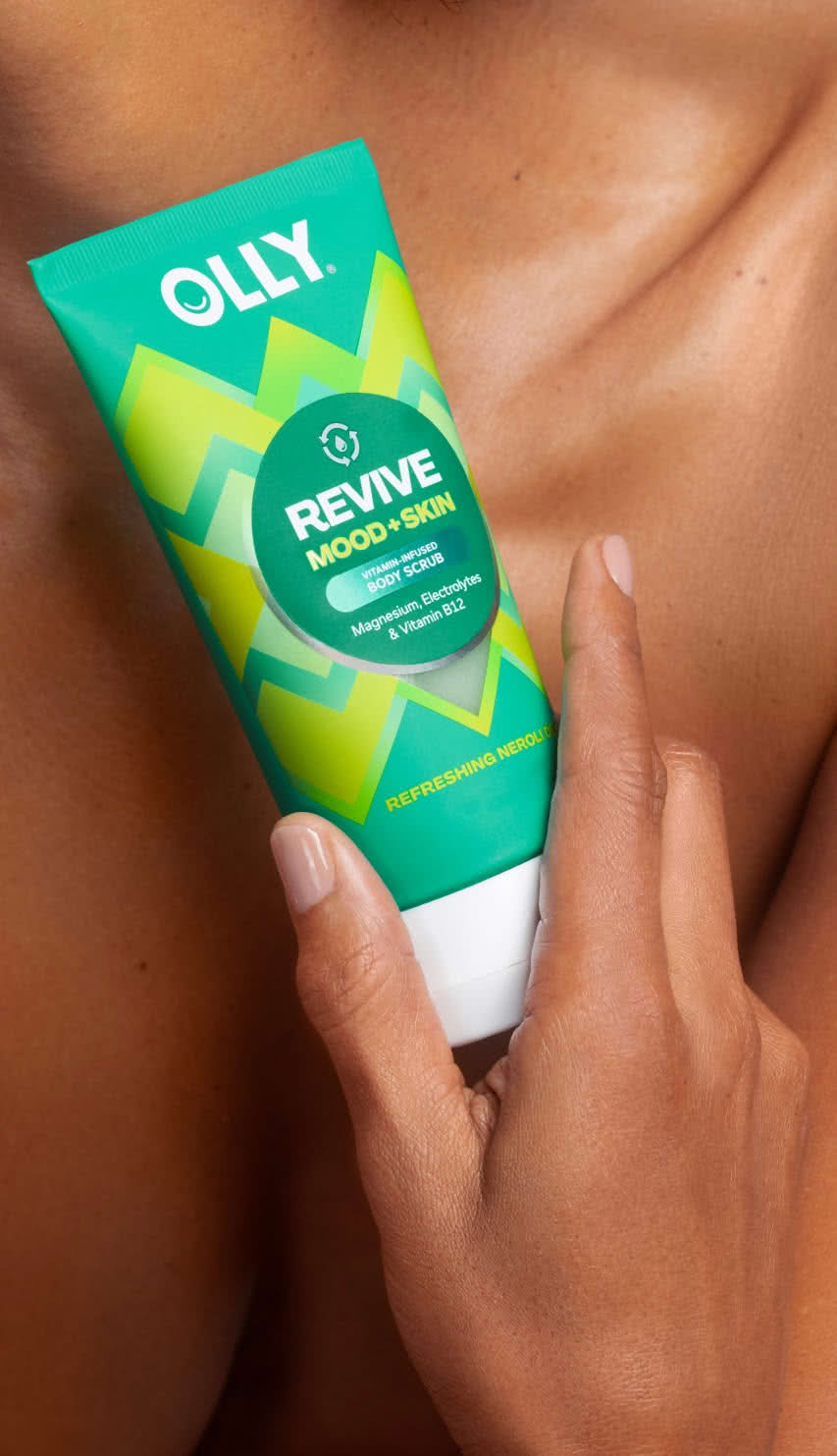 woman holding OLLY Revive Mood + Skin Body Scrub icon