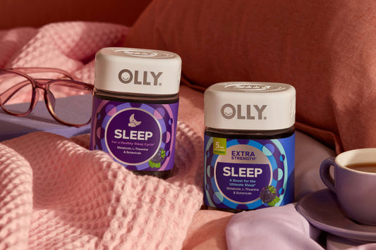 OLLY Sleep products on a bed with tea
