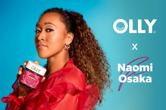 Naomi Osaka holding OLLY Women's Multi Vitamins