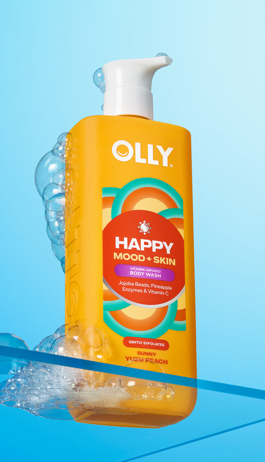 Yellow bottle of Olly Happy Mood + Skin body wash with pump on a blue background icon