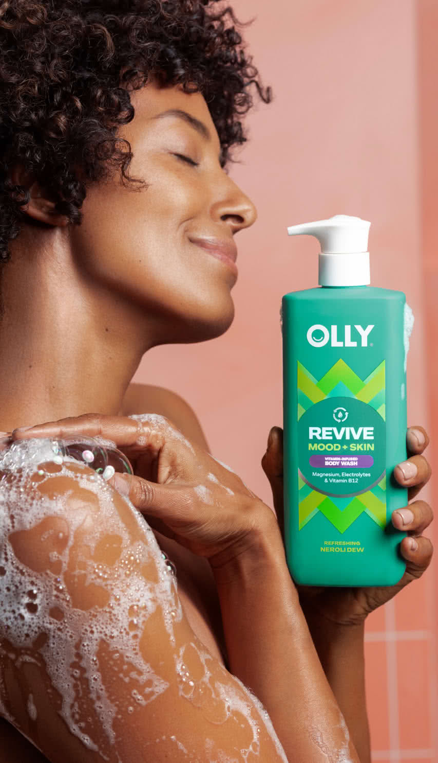 woman holding OLLY Revive Mood + Skin Body Wash icon